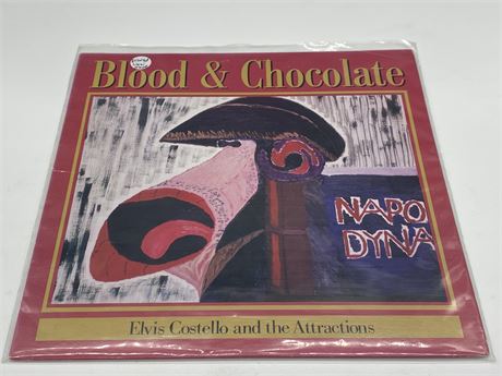 ELVIS COSTELLO AND THE ATTRACTIONS - BLOOD & CHOCOLATE (1986) - NEAR MINT (NM)