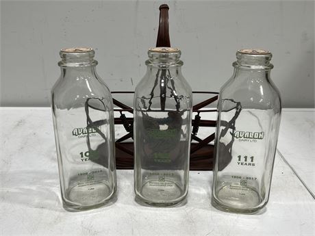 3 VINTAGE GLASS MILK BOTTLES IN METAL CARRIER
