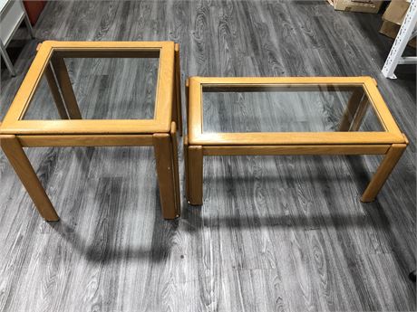 TWO TEAK GLASS TOP TABLES 22IN TALL 24IN WIDE / 17IN TALL 36IN WIDE