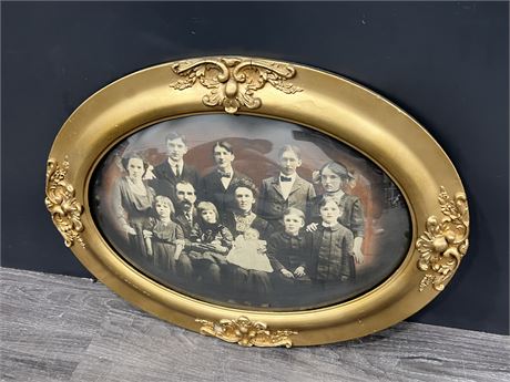 VINTAGE FAMILY PORTRAIT IN CURVED GLASS FRAME (18”x24”)