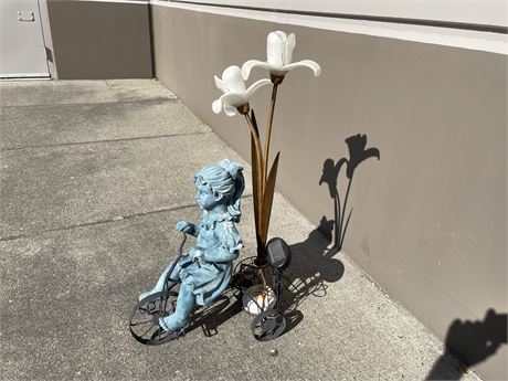 GIRL ON TRICYCLE WITH GLASS FLOWERS 32” TALL
