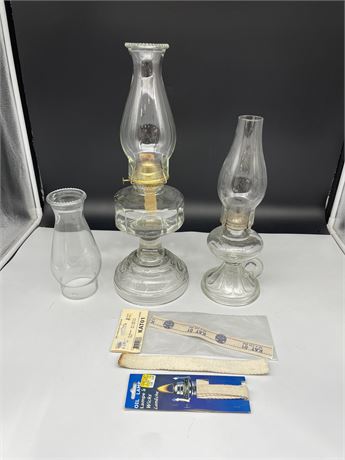 2 VINTAGE GLASS OIL LAMPS W/ ACCESSORIES (LARGER ONE IS 18”TALL)