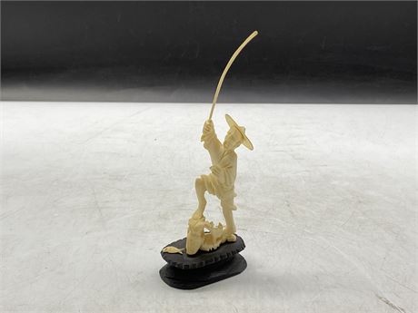EARLY IVORY CARVED FISHERMAN ON BASE (4”)