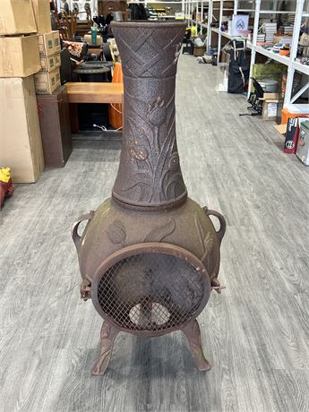 EARLY CAST IRON FLORAL DESIGN POT BELLY FIRE PIT - 50” TALL 24” WIDE