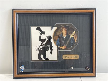 11”x19” FRAMED BRYAN ADAMS SIGNED PHOTO W/ PICTURE DISC 45 - NO OFFICIAL COA