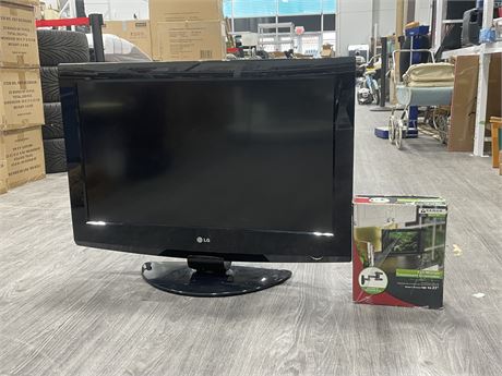 43” LG TV W/ STAND & WALL MOUNT (WORKS)