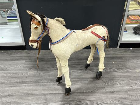 VINTAGE HORSE ON CASTORS MADE W/REAL HAIR (30” long, 34” tall)