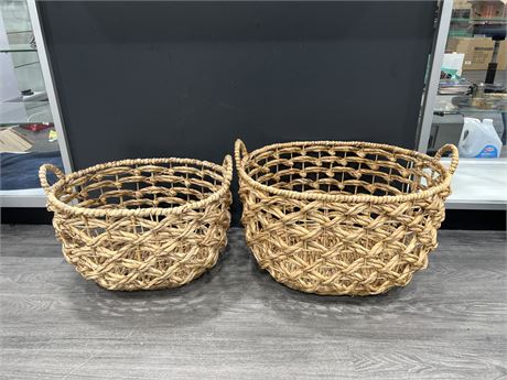 2 LARGE WICKER BASKETS - LARGER ONE IS 22” DIAMETER 15” TALL