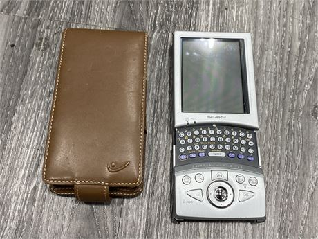 SHARP MODEL SL5500 HANDHELD PDA (Needs charging, not tested as is)