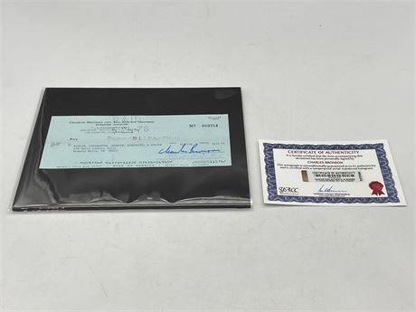 ORIGINAL PERSONAL CHEQUE SIGNED BY CHARLES BRONSON W/COA
