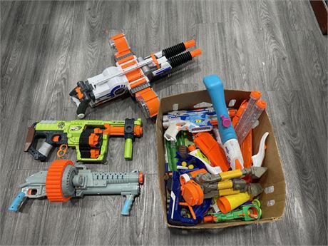 BOX OF NERF GUNS AND BULLETS