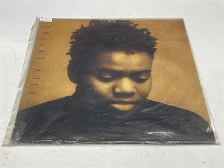 TRACY CHAPMAN RECORD - VG (slightly scratched from sleeve)
