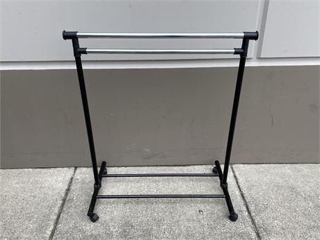 ROLLING CLOTHING RACK (42” tall, extends higher but need pins to hold up)
