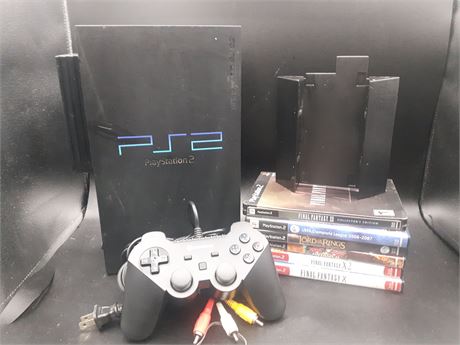 PS2 CONSOLE WITH GAMES AND STAND