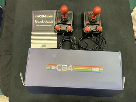 THE C-64 GAMING CONSOLE WITH 2 JOY STICKS