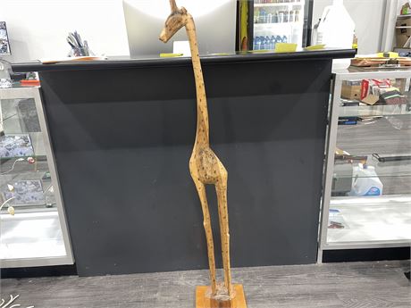 WOODEN CARBED GIRAFFE ON STAND 50”