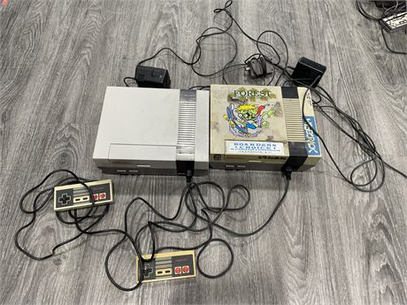 2 NES CONSOLES WITH 2 CONTROLLERS (POWERS ON)