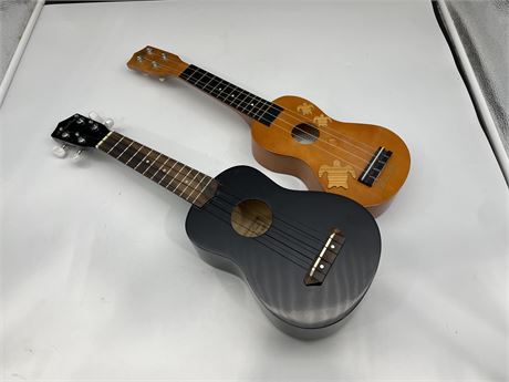 2 MINI GUITARS / UKULELES - BROWN ONE COULD BE DECORATIVE USE ONLY