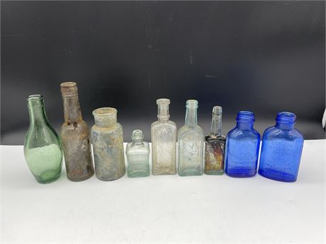 9 ASSORTED SIZE COLOURED GLASS BOTTLES EXCAVATED FROM 237 E.PENDER