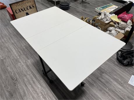 FOLDING TABLE W/ WHEELS (3ft x 5ft x 3ft)