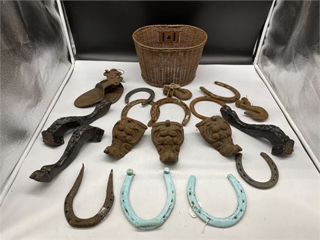 LOT OF VINTAGE CAST IRON / STEEL ITEMS - HORSE SHOES, BED LEGS, ETC
