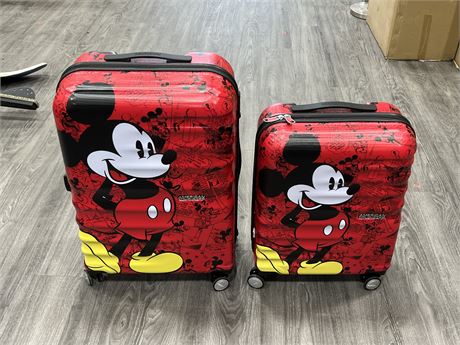 2 DISNEY AMERICAN TOURIST SUITCASES (Tallest is 25”)
