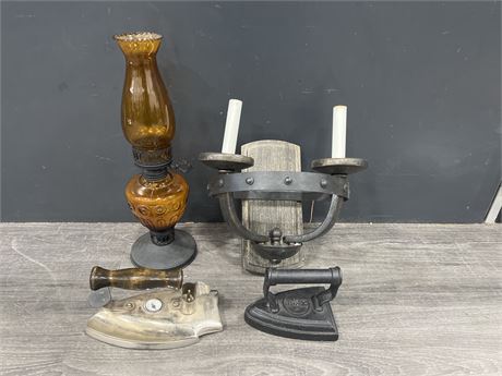 AMBER GLASS OIL LAMP + TWO VINTAGE IRONS & WALL SCONCE