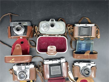 6 CAMERAS W/ LEATHER CASES - AS IS