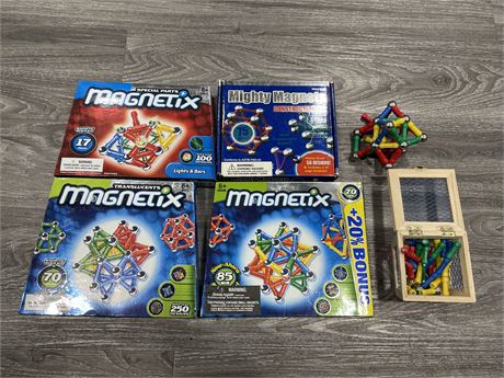 4 BOXES OF MAGNETIC TOYS - LIKE NEW