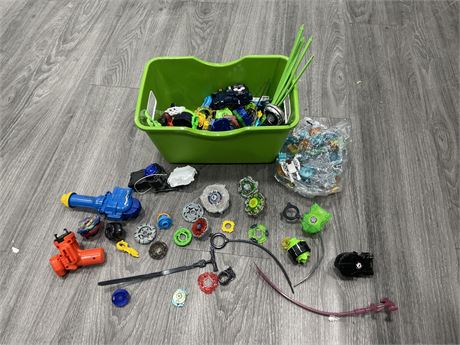 BIN OF ASSORTED BEYBLADES & ACCESSOIRES + LEGO PIECES