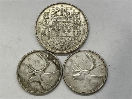2 SILVER QUARTERS + 50 CENT COIN