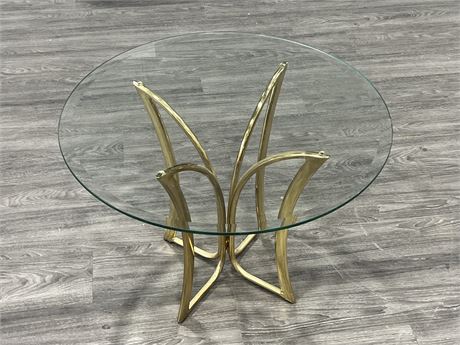VINTAGE BRASS W/GLASS TOP SIDE TABLE (21” tall, 28” wide)