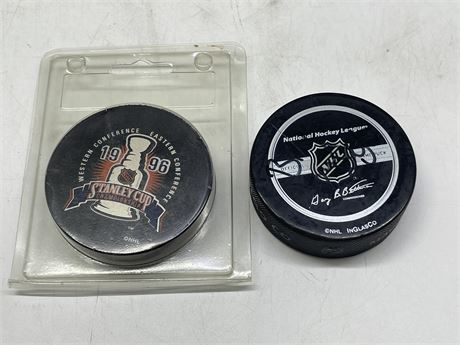 2 NHL OFFICIAL GAME PUCKS (1-SIGNED)