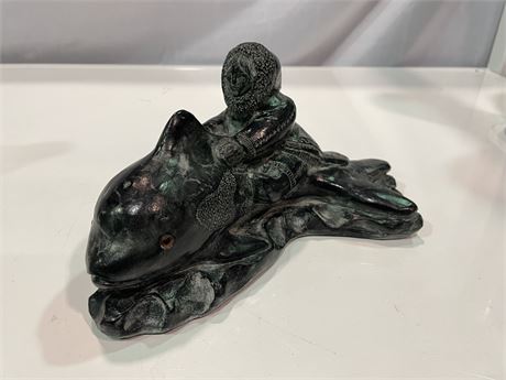 (HAND CARVED IN CANADA) FIGURE RIDING A WHALE